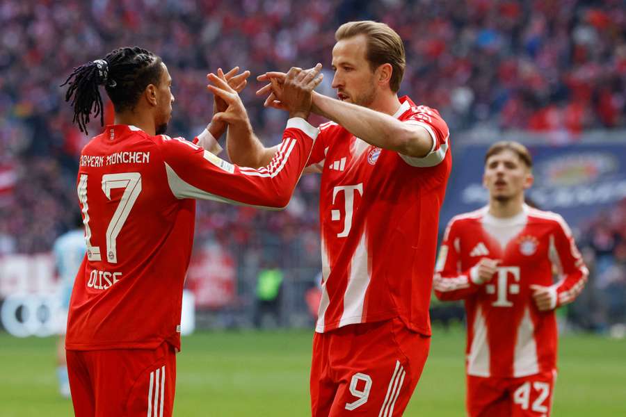 Kane celebrates with Olise