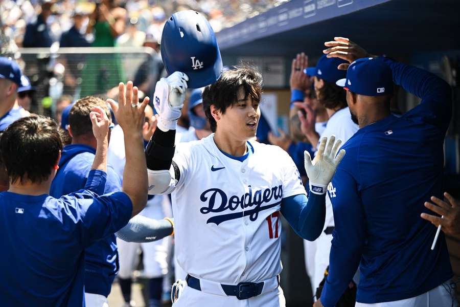 Dodgers' Shohei Ohtani celebrate a home run with his team