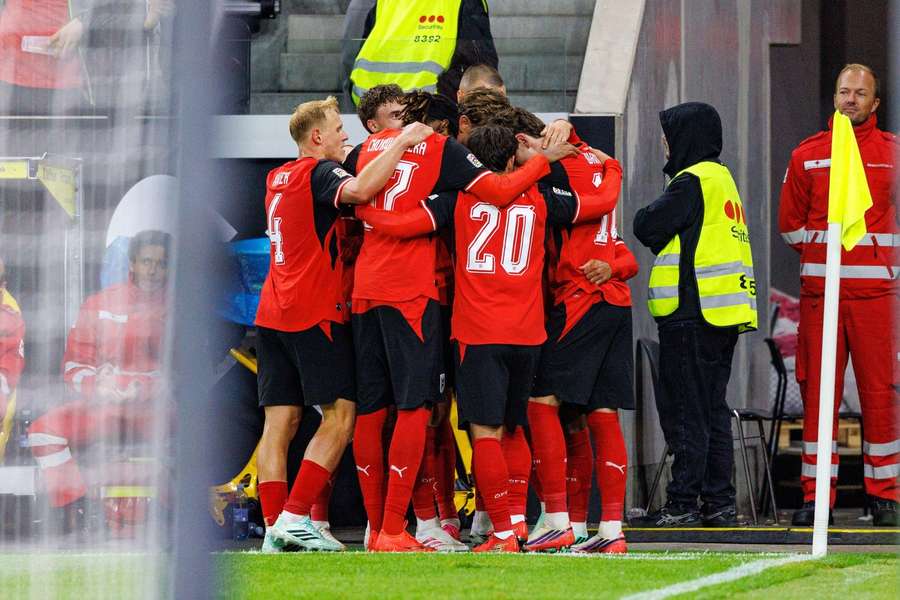 Austria celebrate their third goal Austria celebrate their third goal