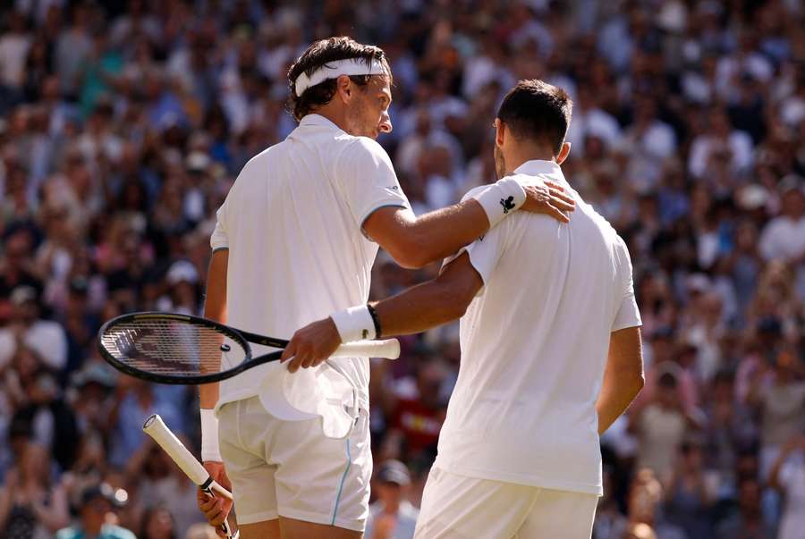 Rinderknech and Djokovic embrace after the match Rinderknech and Djokovic embrace after the match