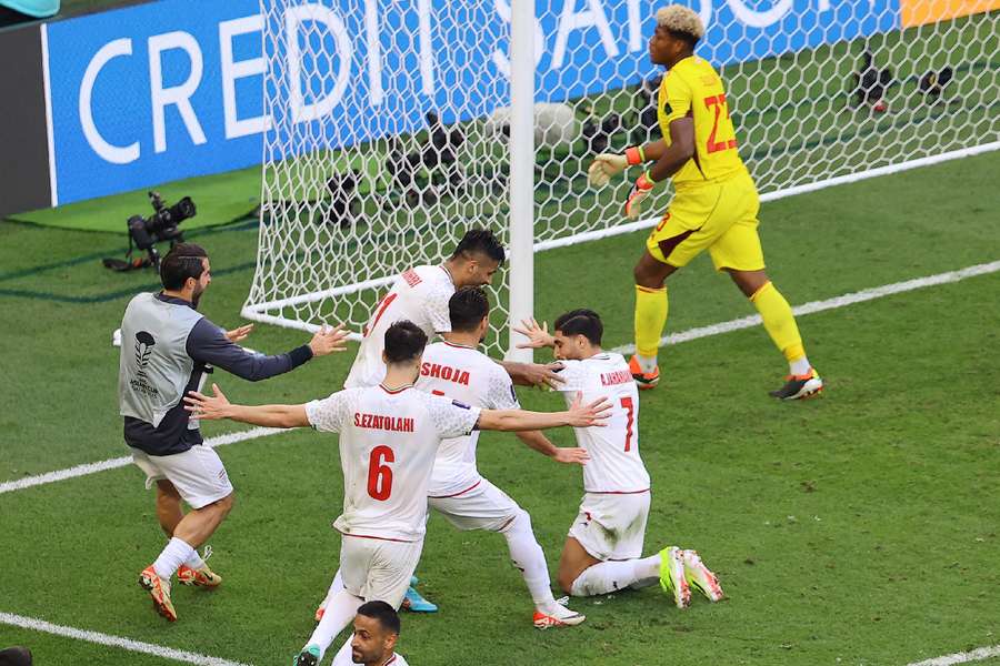 Iran's Alireza Jahanbakhsh celebrates scoring their second goal with teammates