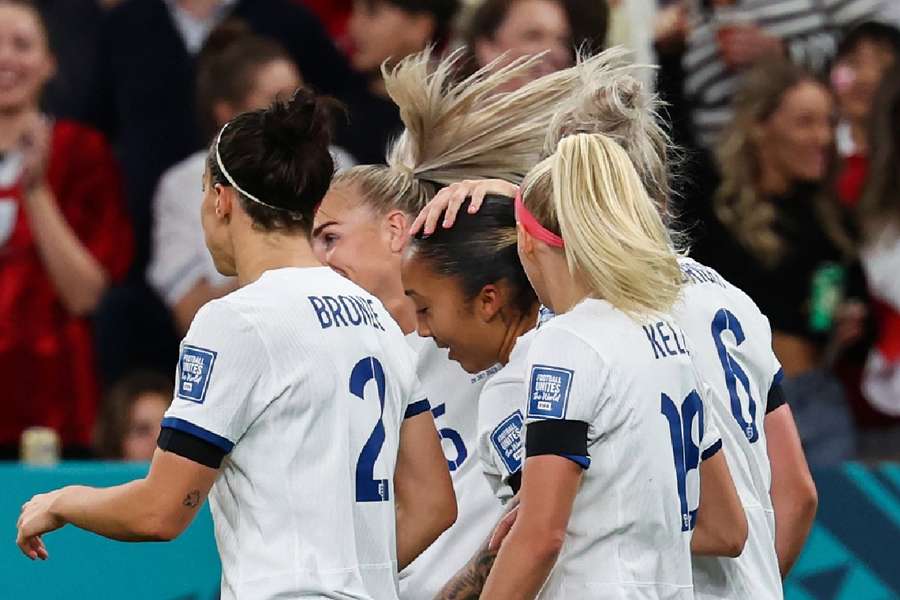 England celebrates with James after she opened the scoring