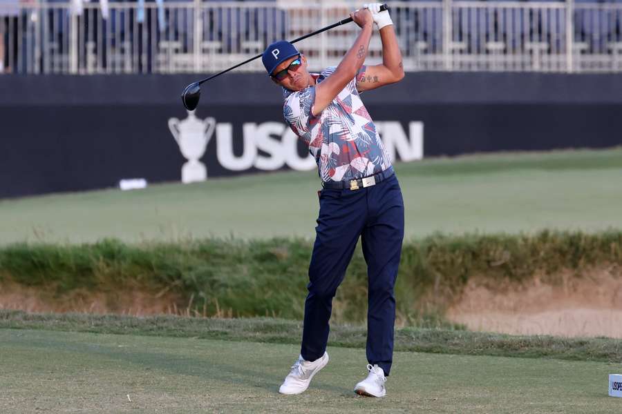 Rickie Fowler hits a tee shot on the 18th hole during the second round of the U.S. Open