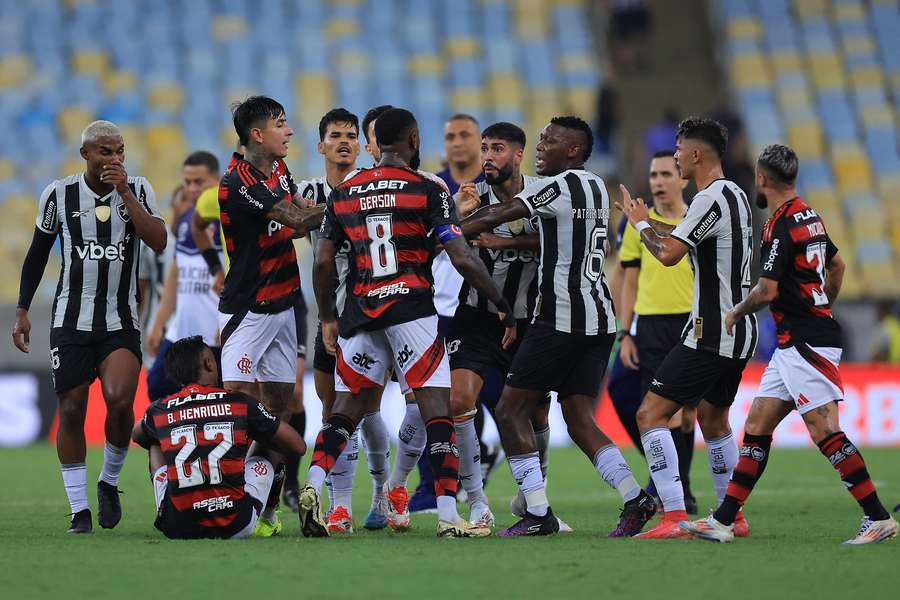 Botafogo and Flamengo players come together during the feisty affair