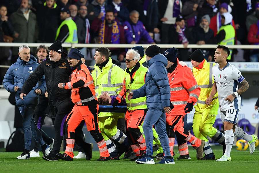 Edoardo Bove is stretchered off after collapsing