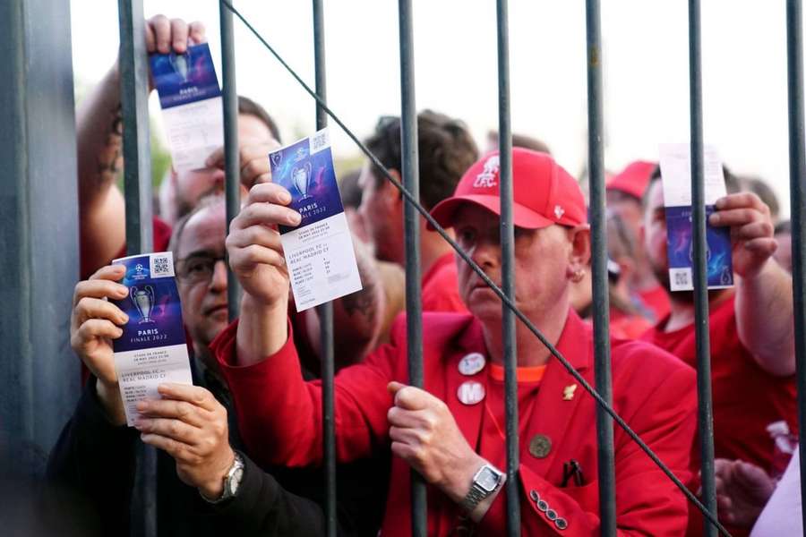 Liverpool fans wait to enter the Stade de France.