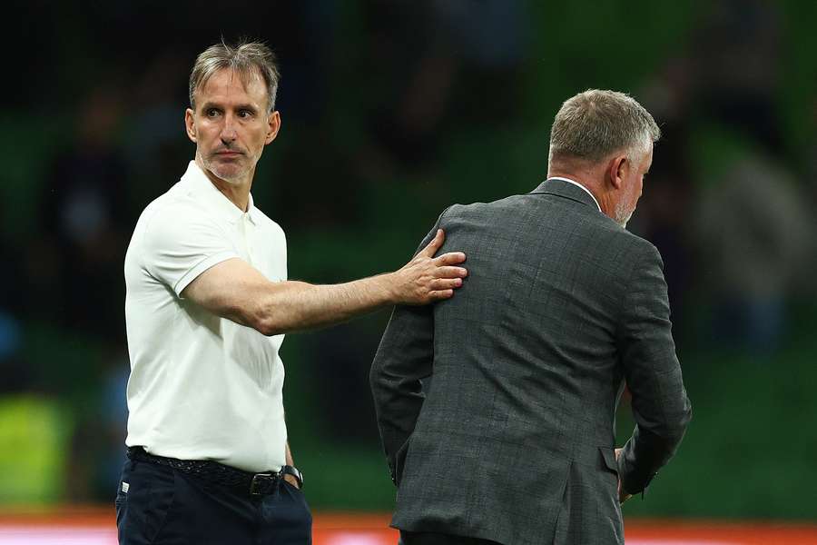 Melbourne City's Aurelio Vidmar and Sydney FC's Ufuk Talay shake hands after their scoreless draw.