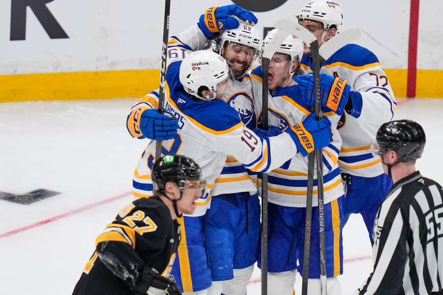 Sabres players celebrate during Game 3 against Boston Bruins
