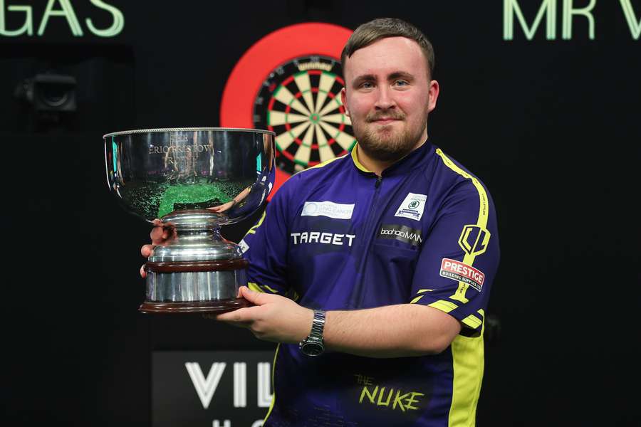 Luke Littler with the Eric Bristow Trophy