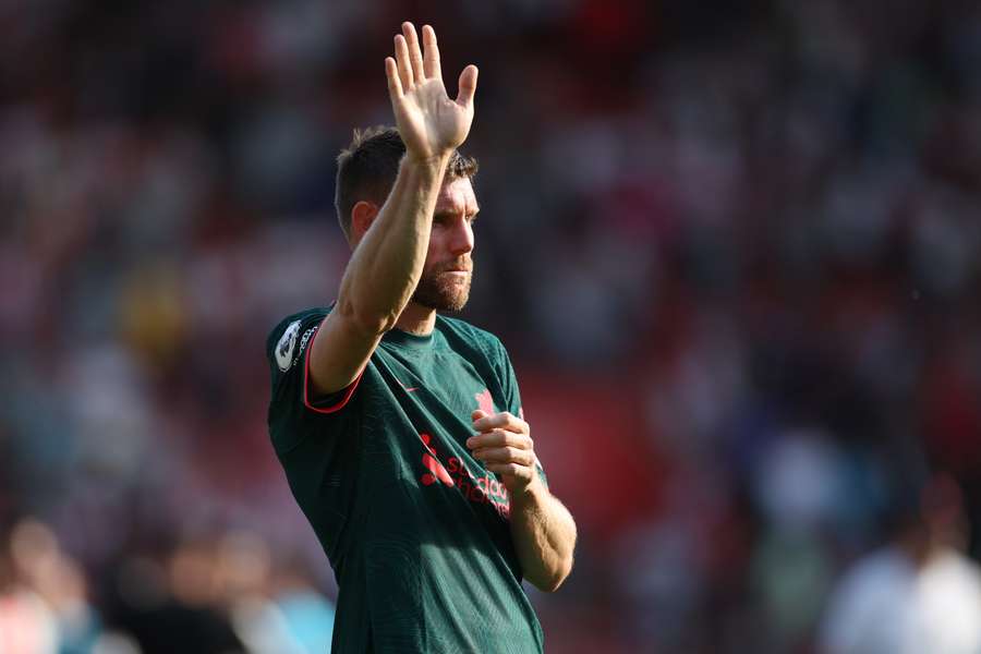 Liverpool's English midfielder James Milner waves to supporters on the pitch after the English Premier League football match between Southampton and Liverpool