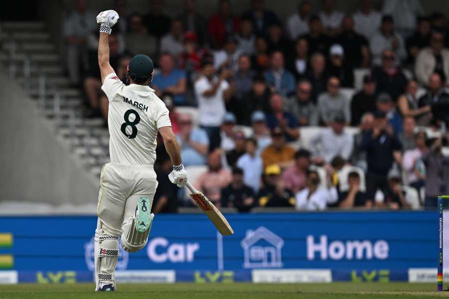 Australia's Mitchell Marsh celebrates reaching his hundred on day one of the third Ashes cricket Test match between England and Australia at Headingley