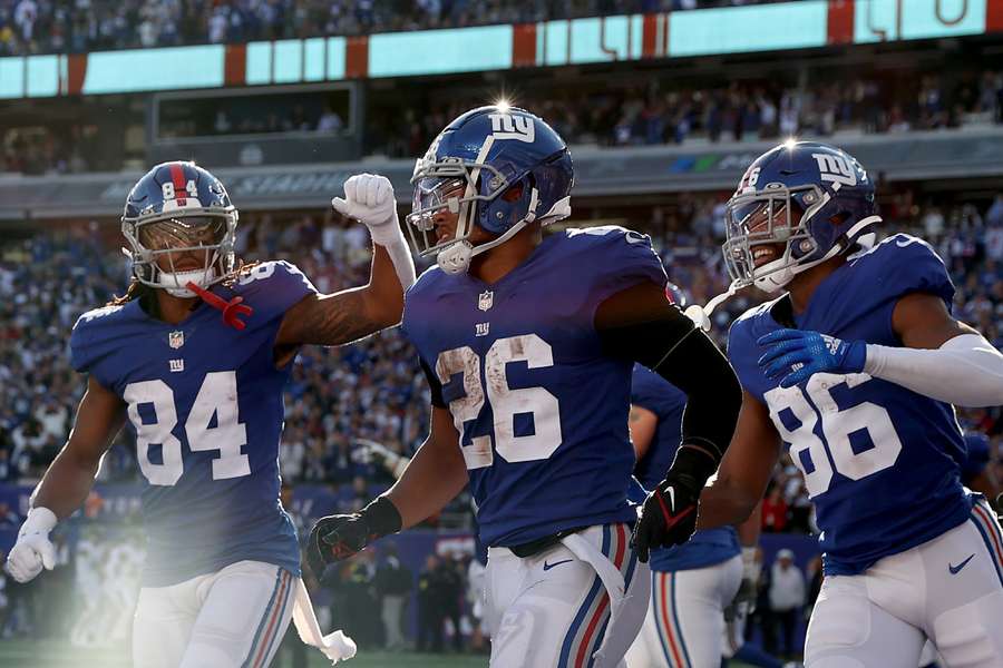 Los jugadores de los New York Giants celebran un Touchdown de Saquon Barkley.