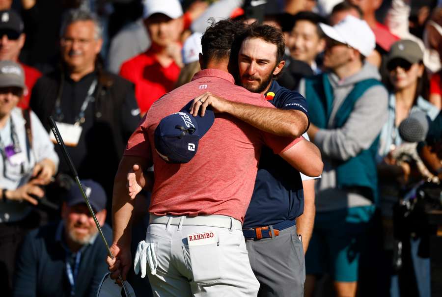 Jon Rahm hugs Max Homa