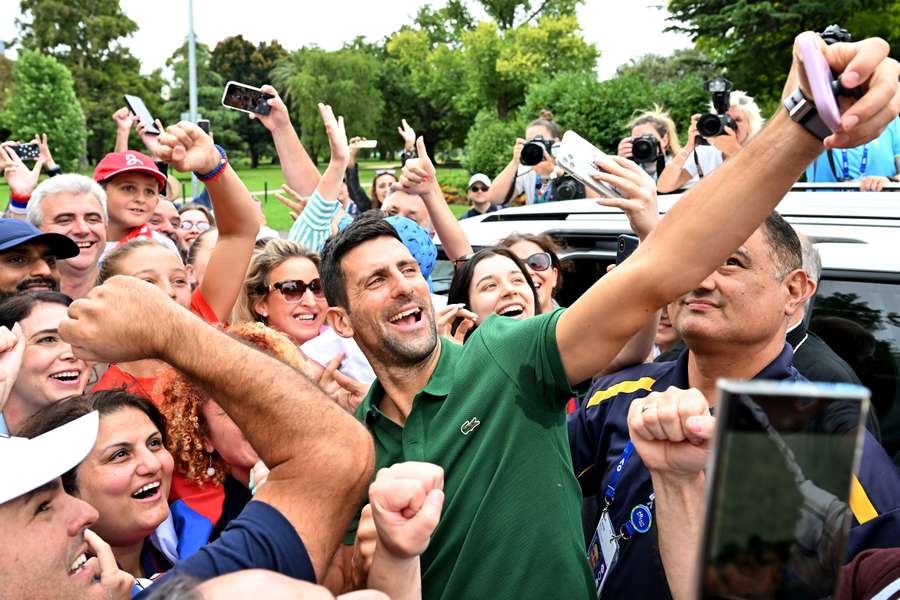 Djokovic poses for photos with fans