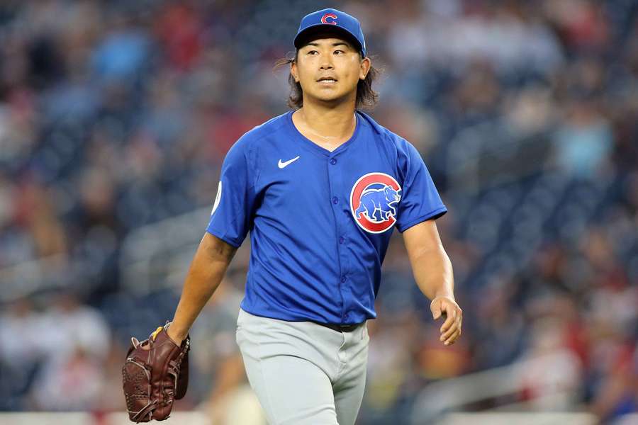 Chicago Cubs pitcher Shota Imanaga (18) walks off the field