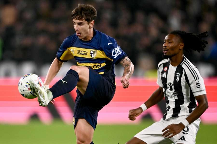 Parma's Adrian Bernabe fights for the ball with Juventus midfielder Khephren Thuram