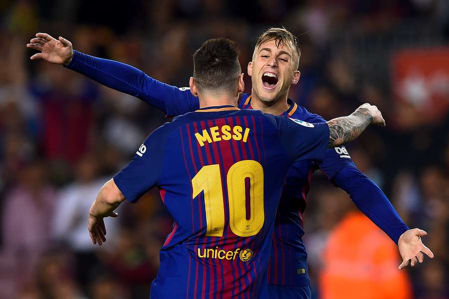 Deulofeu and Messi celebrating a goal with Barca