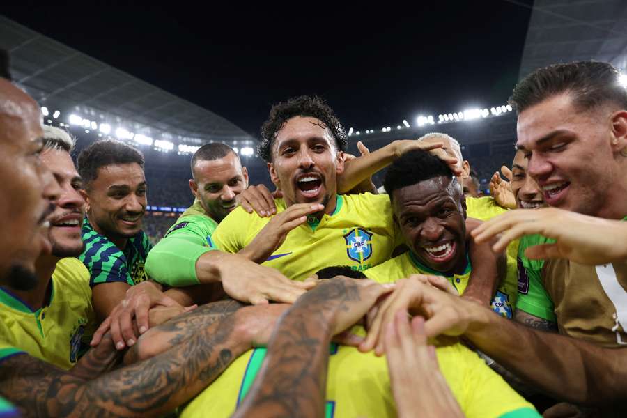 Vinicius Junior, right middle, celebrates Casemiro's winner with his teammates