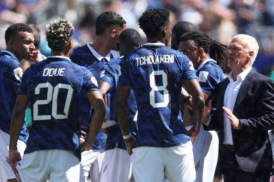 France coach Didier Deschamps gives instructions to Aurelien Tchouameni during the first-half hydration break against Senegal