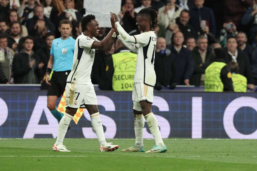 Vinicius Junior celebrates with Real Madrid's French midfielder #12 Eduardo Camavinga scoring his team's second goal