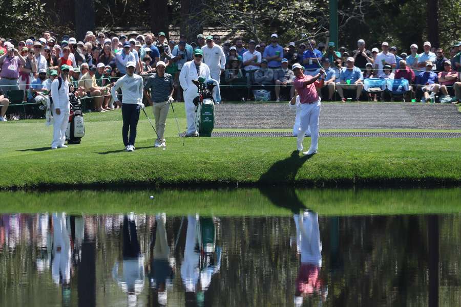 Japan's Hideki Matsuyama skims the ball on the 16th pond during a practice round at The Masters