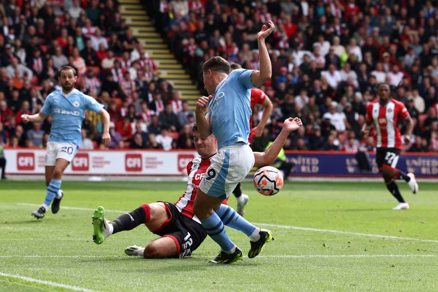 Sheffield United's Irish defender John Egan handles the ball