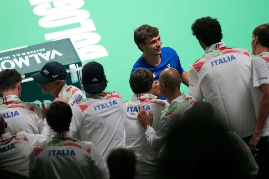 Flavio Cobolli celebrates with the Italian team after sending his nation into the Davis Cup semi-finals Flavio Cobolli celebrates with the Italian team after sending his nation into the Davis Cup semi-finals