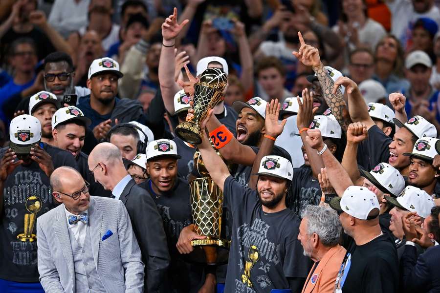 Jalen Brunson (center) lifts NBA MVP trophy after leading Knicks to NBA title Jalen Brunson (center) lifts NBA MVP trophy after leading Knicks to NBA title