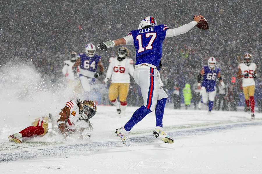 Josh Allen of the Buffalo Bills breaks a tackle by Fred Warner of the San Francisco 49ers as he runs in for a touchdown Josh Allen of the Buffalo Bills breaks a tackle by Fred Warner of the San Francisco 49ers as he runs in for a touchdown