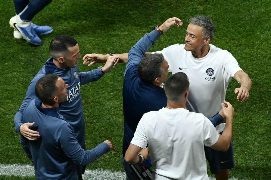 Luis Enrique celebrates making the semi-final with his coaching staff
