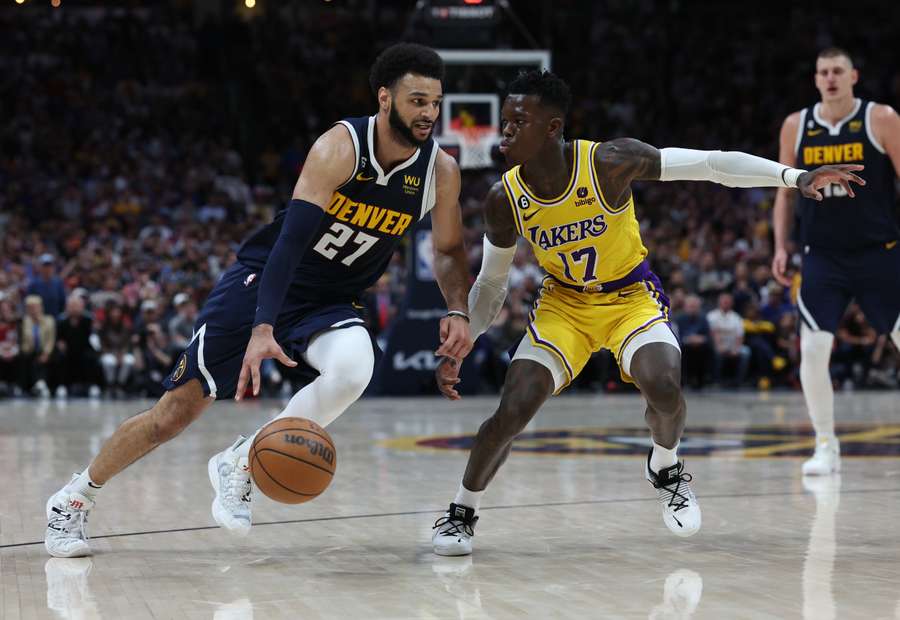 Jamal Murray of the Denver Nuggets drives against Dennis Schroder of the Los Angeles Lakers