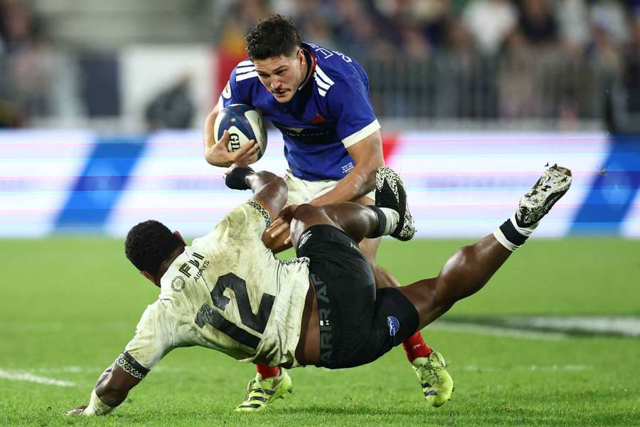 France's Nicolas Depoortere in action with Fiji's Josua Tuisova France's Nicolas Depoortere in action with Fiji's Josua Tuisova