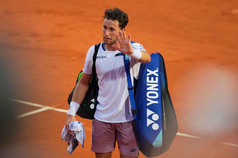 Casper Ruud waves at fans after losing his quarter-final against Jannik Sinner at the Italian Open