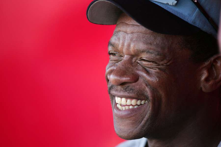 MLB legend Rickey Henderson smiling during an interview in 2005