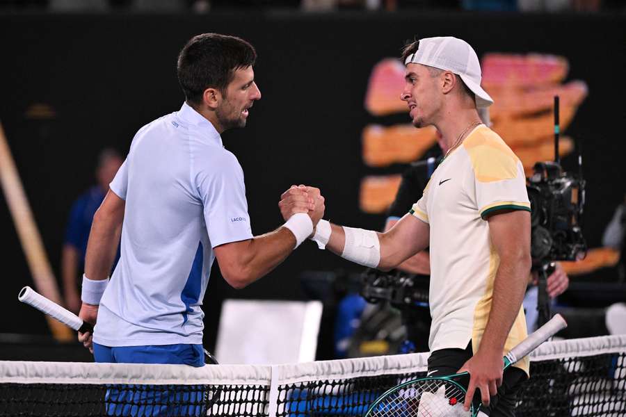 Djokovic (R) shakes hands with Prizmic