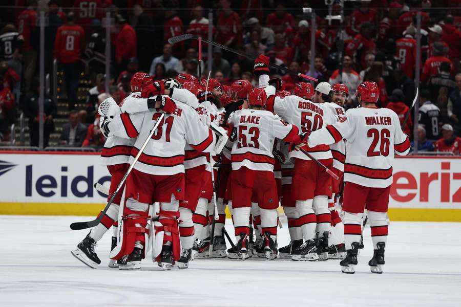 Carolina Hurricanes celebrate a goal against the Washington Capitals during overtime
