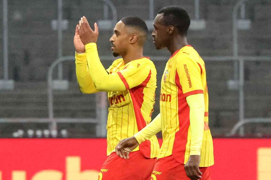 Wesley Said (centre) celebrates after scoring for Lens