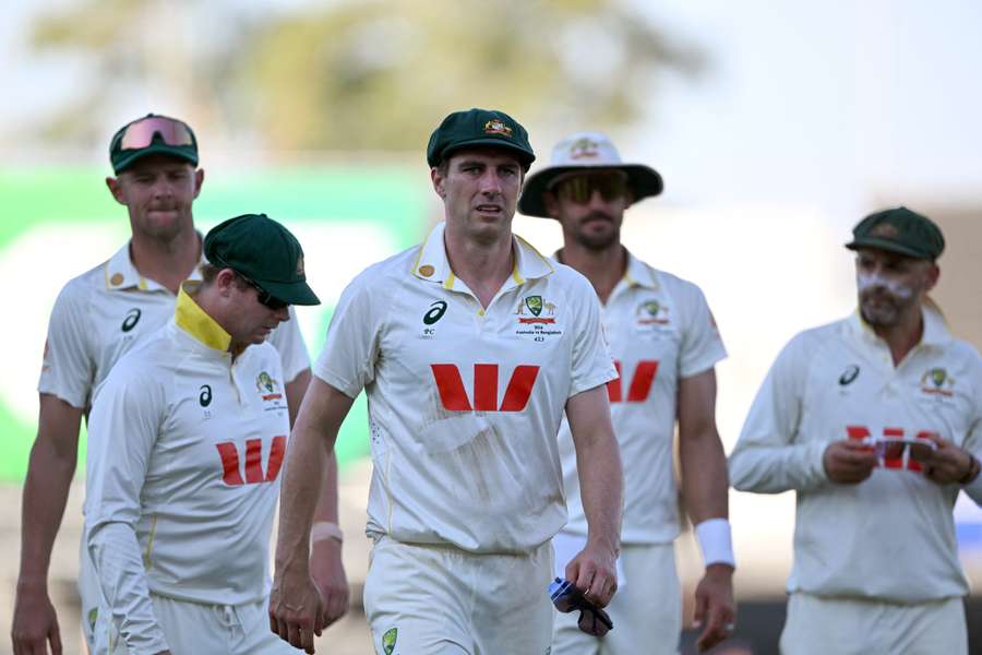 Australia's captain Pat Cummins leads his players off at the end of the second day against Bangladesh Australia's captain Pat Cummins leads his players off at the end of the second day against Bangladesh