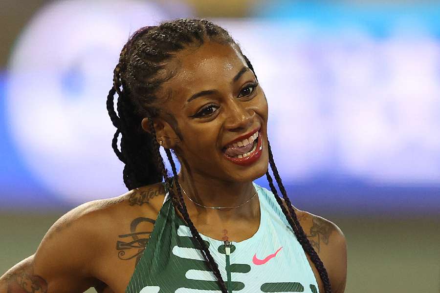 Richardson celebrates after winning the women's 100m in Doha