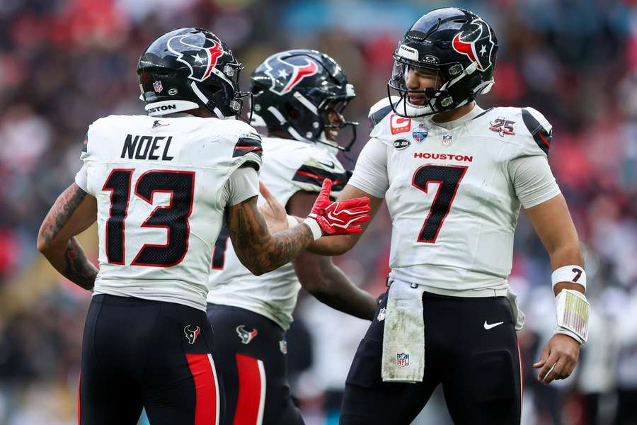 Texans QB CJ Stroud (right) celebrates touchdown with wide receiver Jaylin Noel (left)