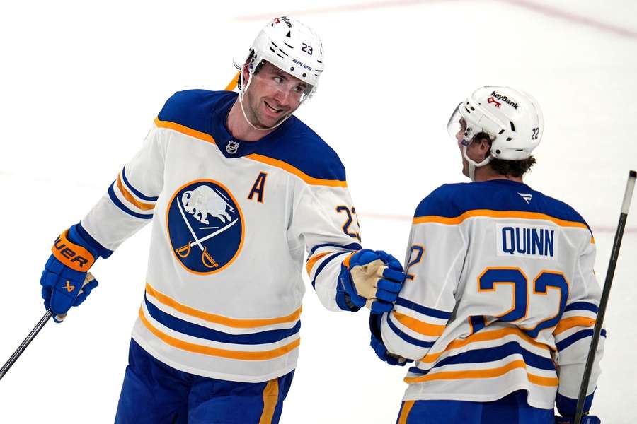 Sabres' Mattias Samuelsson (left) celebrates goal with Jack Quinn