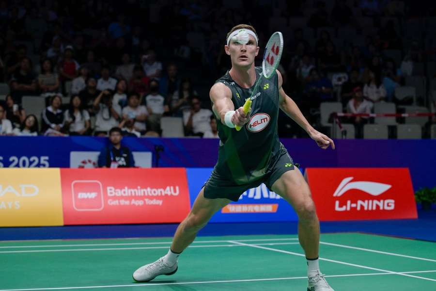 Viktor Axelsen fought his way out of trouble against Yushi Tanaka