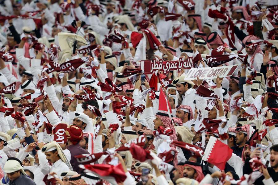 Qatar fans watch on