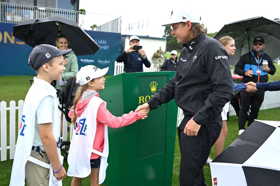 Australian star Cam Smith speaks to some young fans at the Australian PGA Championship in Brisbane last week. Australian star Cam Smith speaks to some young fans at the Australian PGA Championship in Brisbane last week.