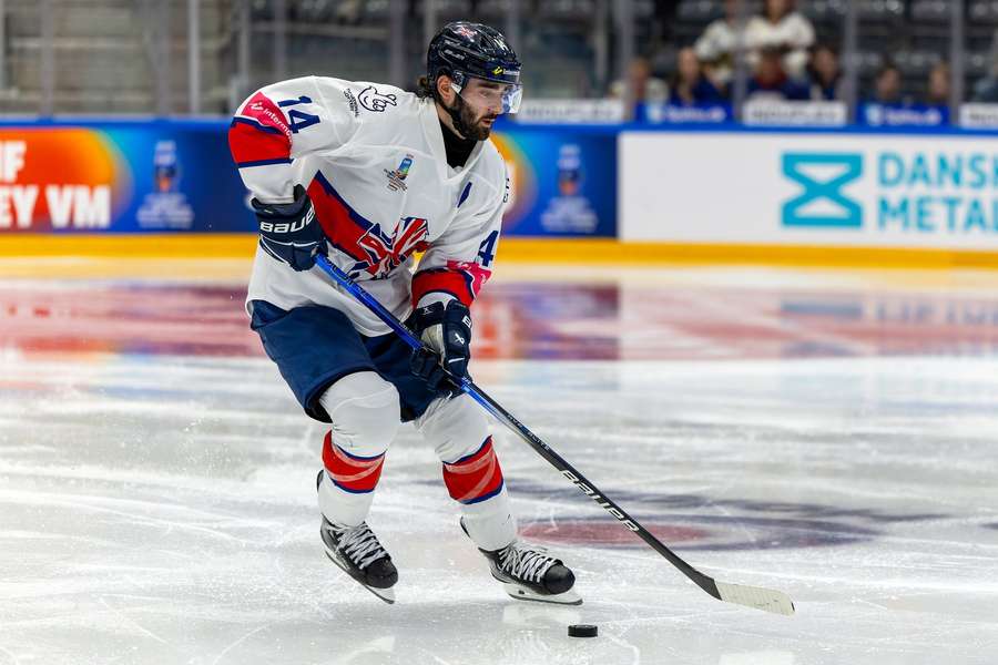 Great Britain forward Liam Kirk handles the puck