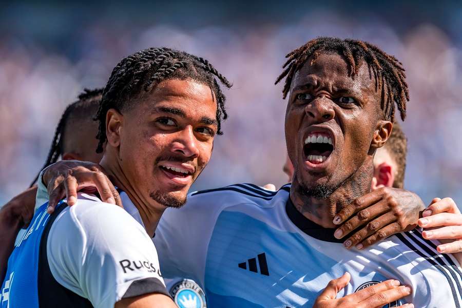 Zaha (R) celebrates a huge Charlotte victory