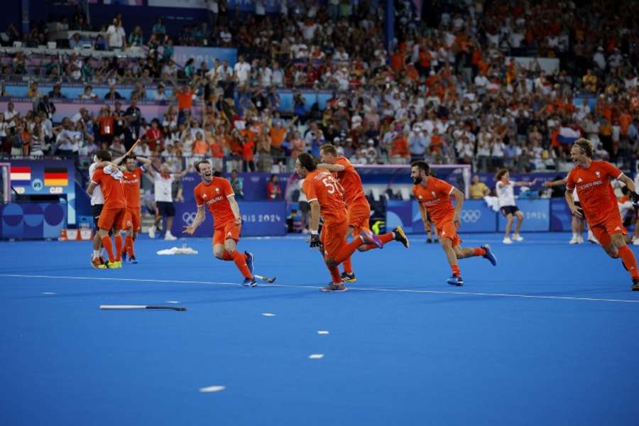 The Dutch players celebrate after winning the final