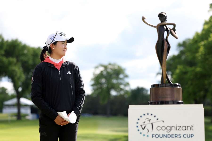 Zhang poses with the Founders Cup trophy