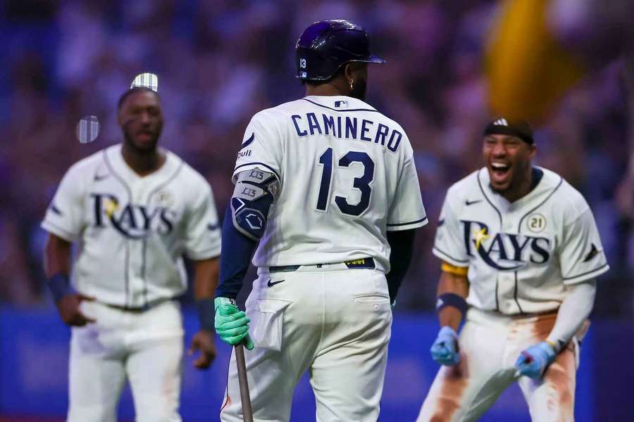 Tampa Bay Rays' Junior Caminero (13) and teammates celebrate after a walk-off home run