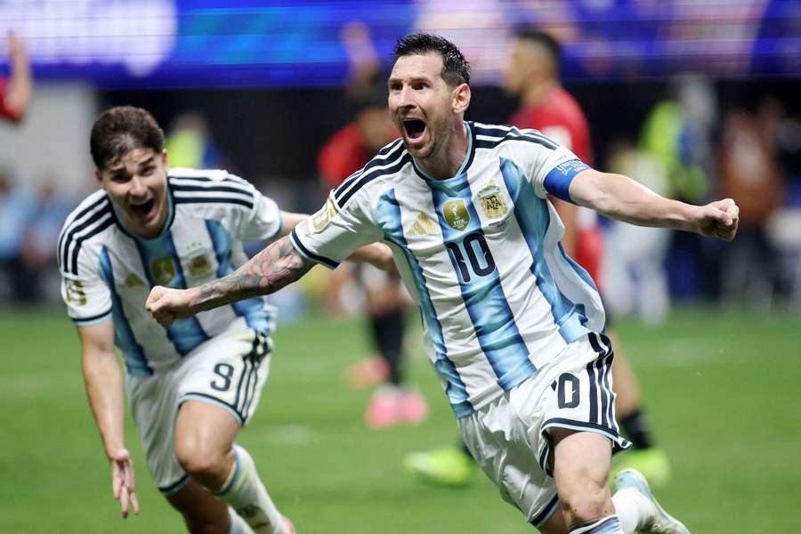 Lionel Messi celebrates scoring Argentina's second goal against Egypt alongside Julian Alvarez
